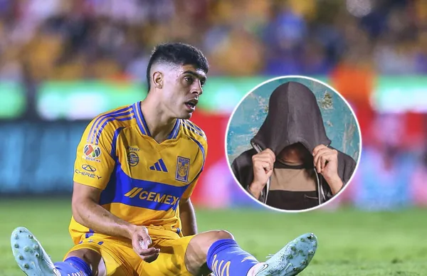 Juan Brunetta en el césped e imagen de hombre a su lado/ Foto Rafael Rivera.