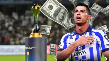 Cristiano Ronaldo con billetes volando y el trofeo del Mundial de Clubes  Foto: Goal
